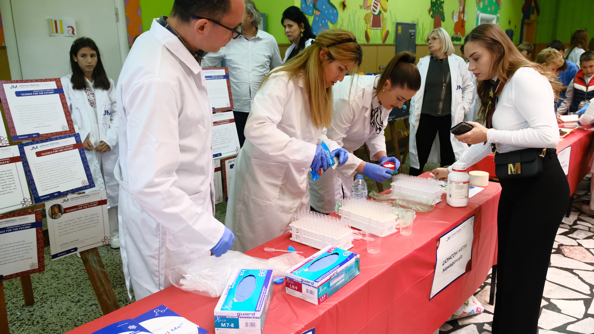 Teachers and students doing experiments at the science event