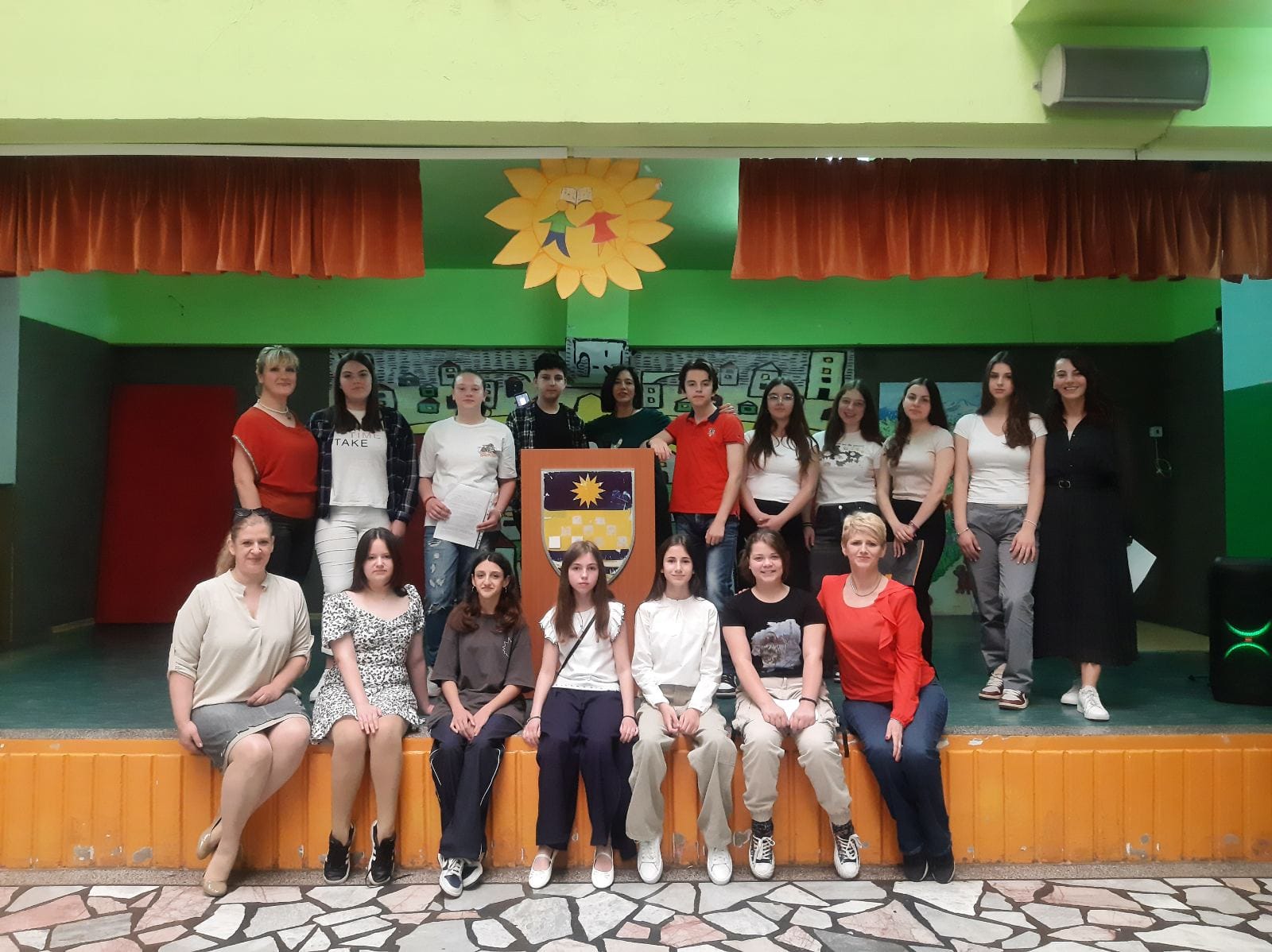 A group photo of the students with the school's Director